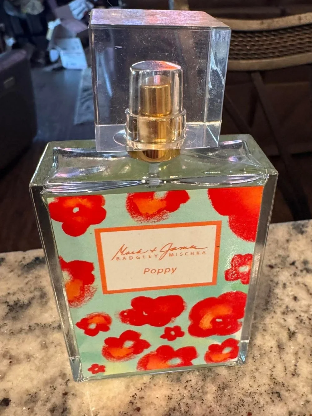 Badgley Mischka Poppy  Magnolia, Peony, and Plumeria add a romantic sweet floral